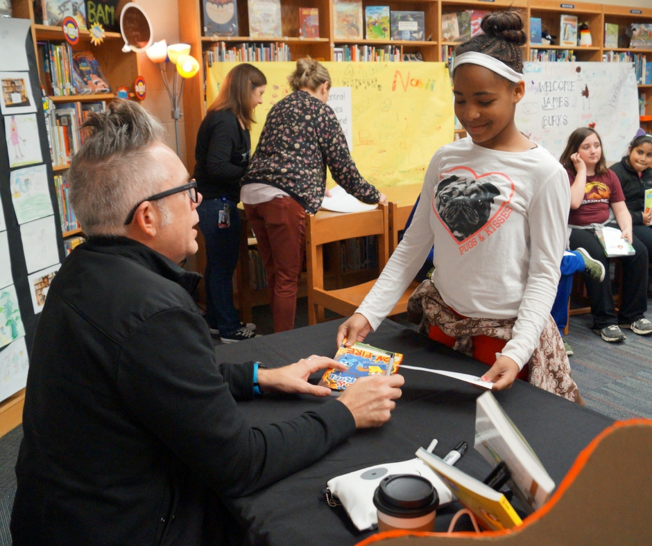 Student visiting with author